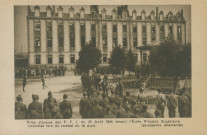 Ussel : "Prise d'armes de F.F.I. du 30 août 1944 devant l'Ecole primaire supérieure incendiée lors du combat du 16 août. (ex-caserne allemande)".