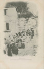 Treignac : "La Corrèze illustrée - Treignac - La procession passant sous la porte de la ville".